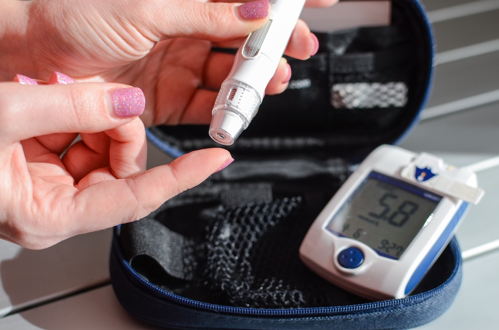 a woman uses diabetic supplies after learning how to sell your Dexcom supplies