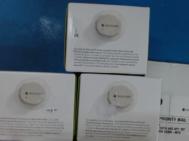 Diabetic test strip box showing surface damage caused by customer removing pharmacy label resulting in 50 percent payout deduction
